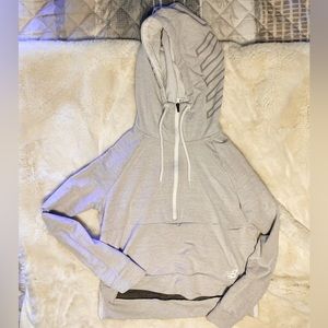 New balance quarter zip hoodie. Slightly cropped front with longer back.